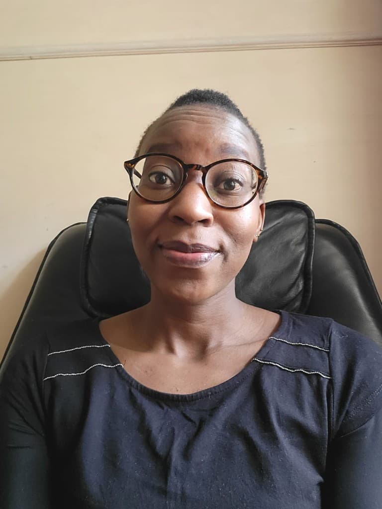 Portrait of Emily Akoth, Community Outreach Coordinator at CLIP-KENYA